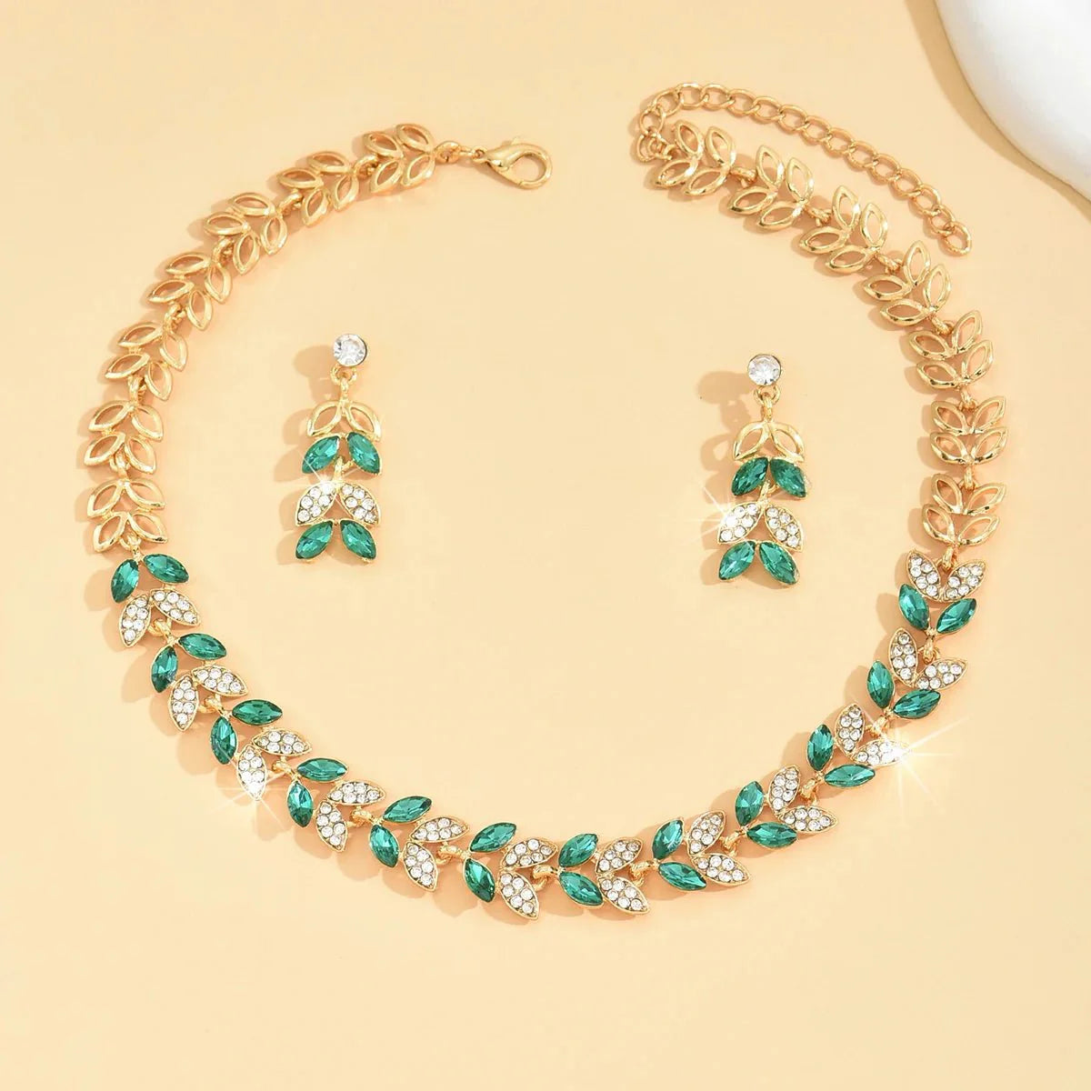 https://cdn.shopify.com/s/files/1/0820/4999/0943/files/emerald-leaf-diamond-necklace-and-earring-set-300382.webp?v=1718191083