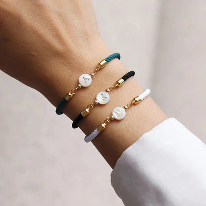 https://cdn.shopify.com/s/files/1/0820/4999/0943/files/adjustable-dainty-letter-initial-bracelet-201765.webp?v=1712446128