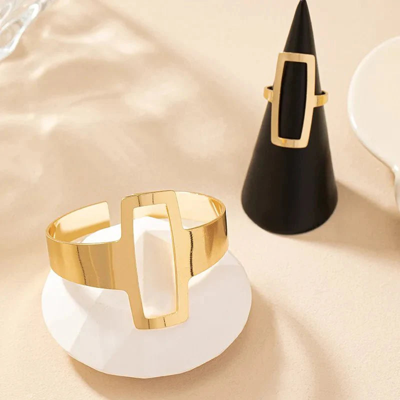 https://cdn.shopify.com/s/files/1/0820/4999/0943/files/adjustable-geometric-rectangle-bracelet-and-ring-set-847406.webp?v=1718190962