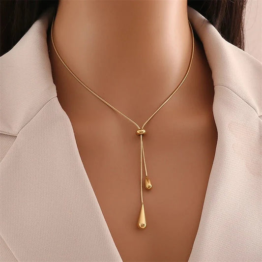 https://cdn.shopify.com/s/files/1/0820/4999/0943/files/adjustable-pull-droplet-lariat-necklace-and-earrings-122906.webp?v=1762198379