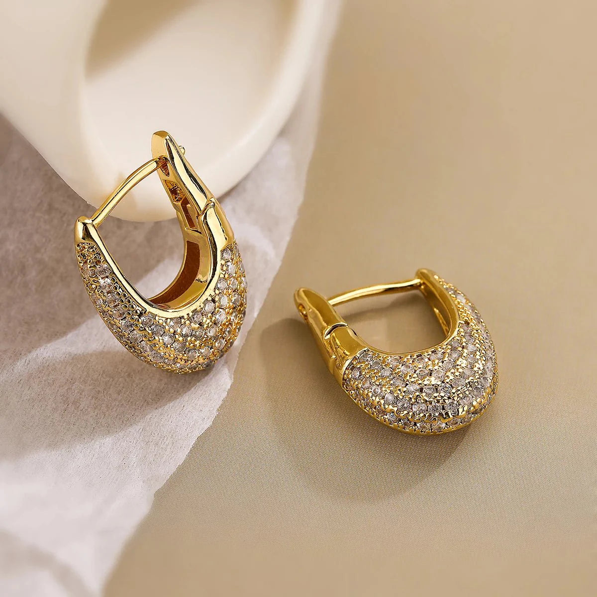 https://cdn.shopify.com/s/files/1/0820/4999/0943/files/chunky-glittering-diamond-hoop-earrings-246541.webp?v=1718605381
