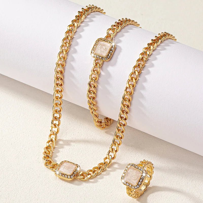 https://cdn.shopify.com/s/files/1/0820/4999/0943/files/cuban-square-diamond-necklace-bracelet-and-ring-set-571410.webp?v=1721837032