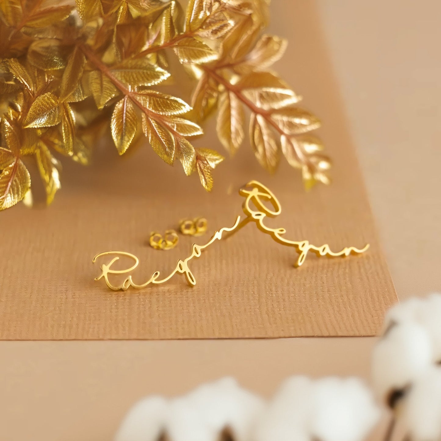 https://cdn.shopify.com/s/files/1/0820/4999/0943/files/dainty-personalized-name-earrings-884712.jpg?v=1720262598