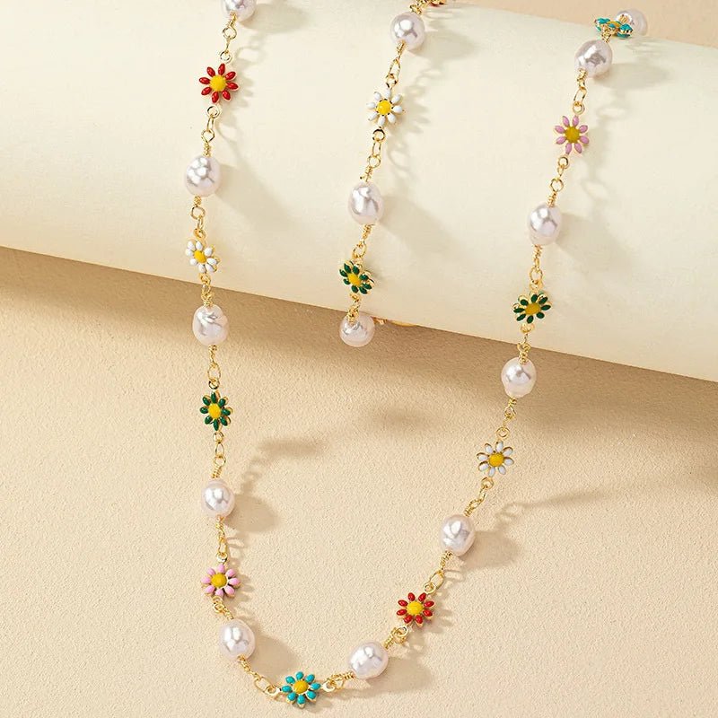 https://cdn.shopify.com/s/files/1/0820/4999/0943/files/dainty-spring-floral-pearls-bracelet-and-necklace-set-660432.webp?v=1715165103