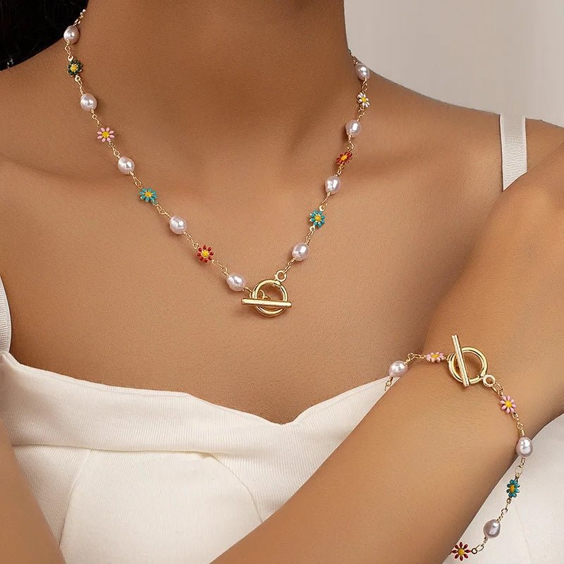 https://cdn.shopify.com/s/files/1/0820/4999/0943/files/dainty-spring-floral-pearls-bracelet-and-necklace-set-809904.jpg?v=1762198258