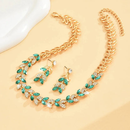 https://cdn.shopify.com/s/files/1/0820/4999/0943/files/emerald-leaf-diamond-necklace-and-earring-set-980856.webp?v=1718191083