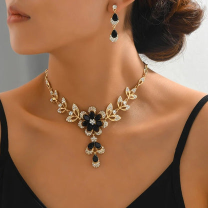 https://cdn.shopify.com/s/files/1/0820/4999/0943/files/floral-black-and-gold-diamond-necklace-and-earring-set-296837.jpg?v=1718191087