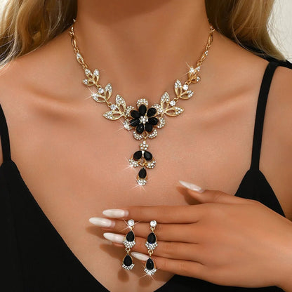 https://cdn.shopify.com/s/files/1/0820/4999/0943/files/floral-black-and-gold-diamond-necklace-and-earring-set-994447.webp?v=1762198310