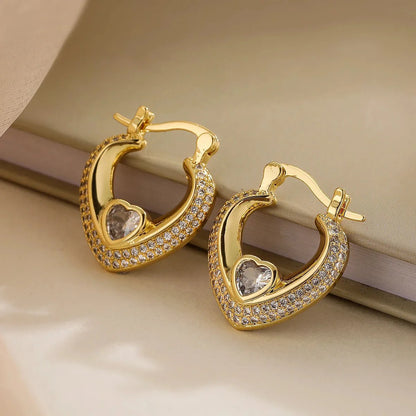 https://cdn.shopify.com/s/files/1/0820/4999/0943/files/glamorous-diamond-heart-earrings-504227.webp?v=1718522729