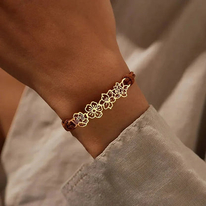 https://cdn.shopify.com/s/files/1/0820/4999/0943/files/personalized-birth-flower-bracelet-373432.webp?v=1762198577